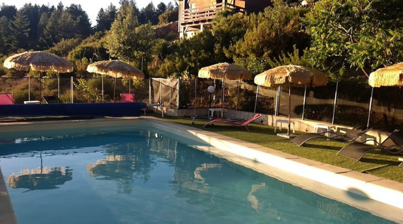 Photos 2 - Touristique - Dpt Corse (20), à vendre EVISA, ensemble de six chalets en bois avec terrasse, sur terrain avec piscine et parking