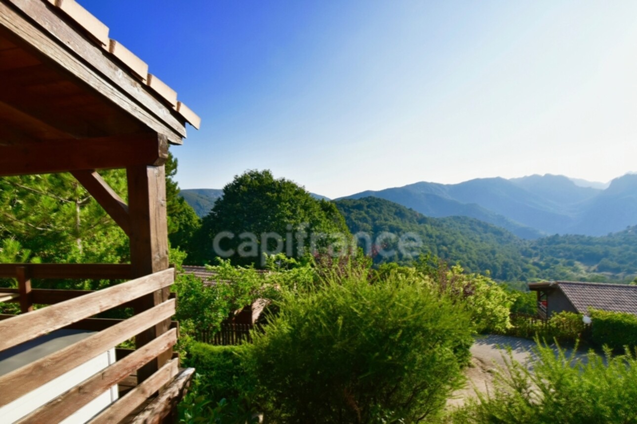 Photos 3 - Tourist - Dpt Corse (20), à vendre EVISA, ensemble de six chalets en bois avec terrasse, sur terrain avec piscine et parking